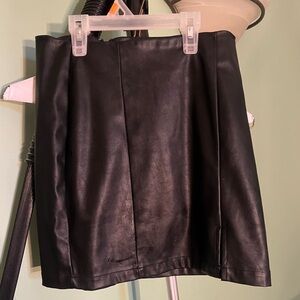 Black leather skirt with a slit